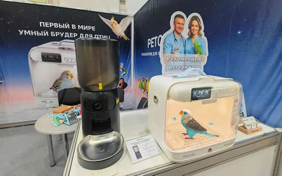PETOLIVA booth display at Russian pet exhibition parkzoo, smart bird brooder and automatic bird feeder showcase with vet recommendation cutout